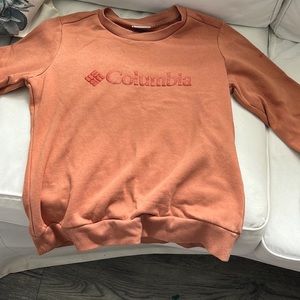 This is a Columbia orange crew neck in a kids medium.